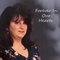 Woman memorial portrait with 'Forever in Our Hearts'