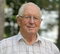 Elderly man outdoors in plaid shirt