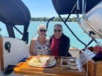 Couple enjoying a meal on a boat.