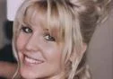 Smiling person with blonde hair and bangs.