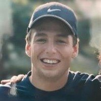 Smiling person wearing cap outdoors