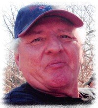 Older man wearing a cap outdoors