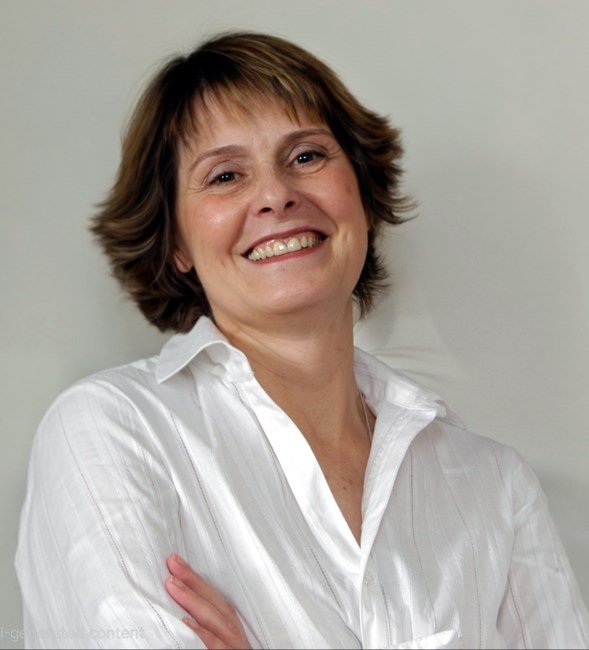 RING, Carmelita Maria Ring Smiling person wearing white shirt.