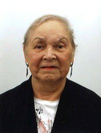 Elderly woman with short hair and earrings