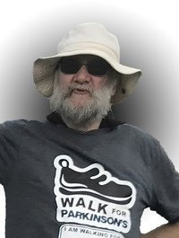 Man in hat wearing Walk for Parkinson's shirt