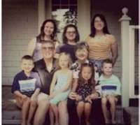 Family group photo on porch steps
