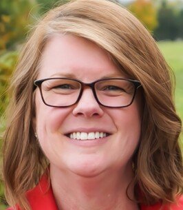 Smiling woman wearing glasses outdoors