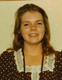 Smiling person in vintage polka dot dress