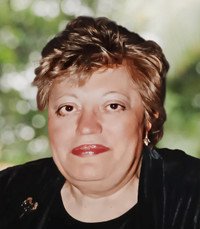 Smiling woman with short hair and earrings