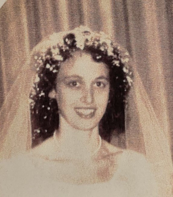 Smiling bride with flower crown and veil
