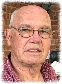 Elderly man with glasses and checkered shirt