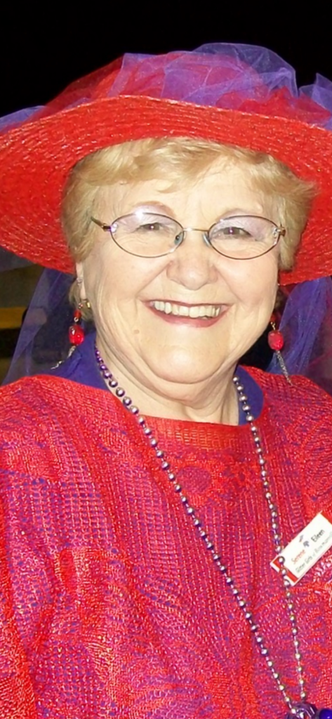 Smiling woman in red hat and outfit