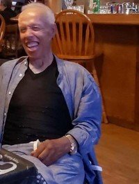 Smiling man in restaurant setting