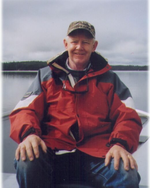 Person in red jacket on a boat