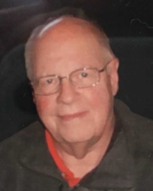 Older man smiling with glasses