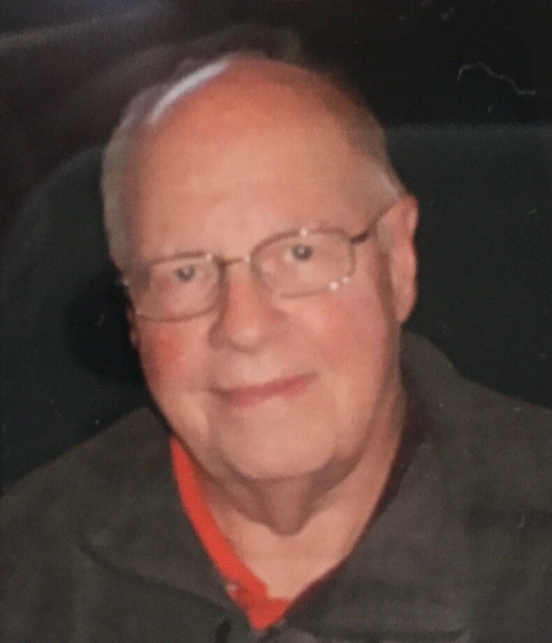 Older man smiling with glasses