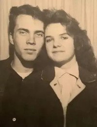 Vintage photo of a young couple posing together.