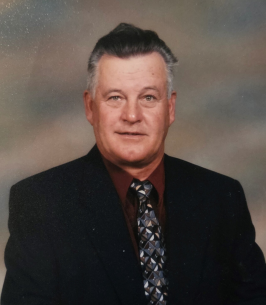 Smiling man in suit with patterned tie