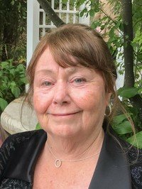 Smiling woman in garden setting