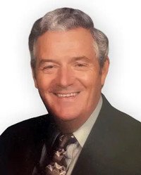 Smiling man in suit with patterned tie
