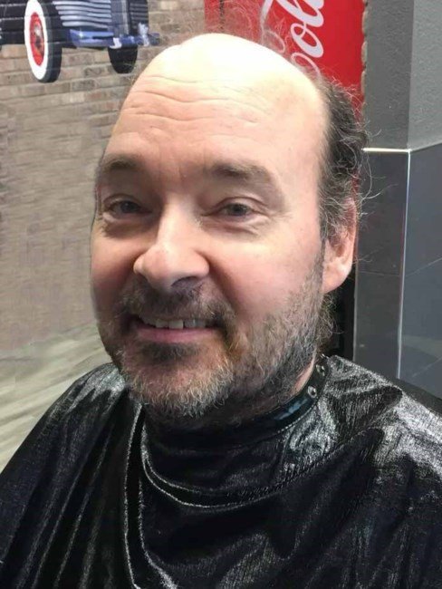Smiling man at a barbershop