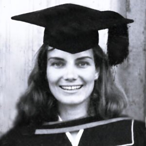 Smiling graduate in cap and gown