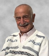 Smiling elderly man in patterned sweater