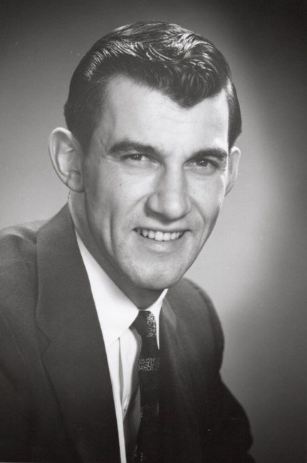 Smiling man in suit, vintage portrait.