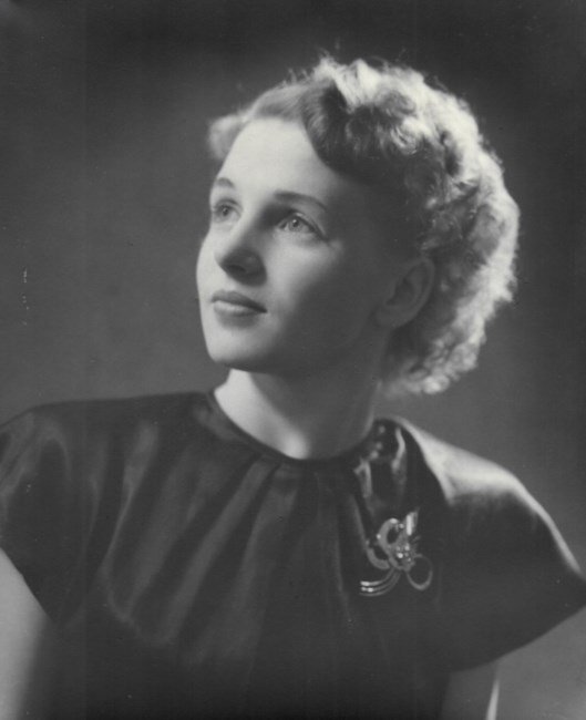 Vintage portrait of a woman in elegant attire.