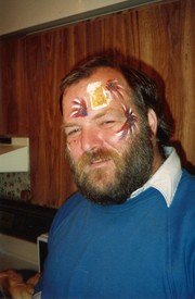 Smiling man with painted face decorations