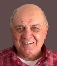 Smiling older man in checkered shirt