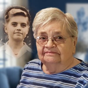 Elderly woman with past portrait, thoughtful expression.