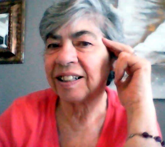 RENNIE, Elaine Margaret Rennie Smiling woman with gray hair and pink shirt.