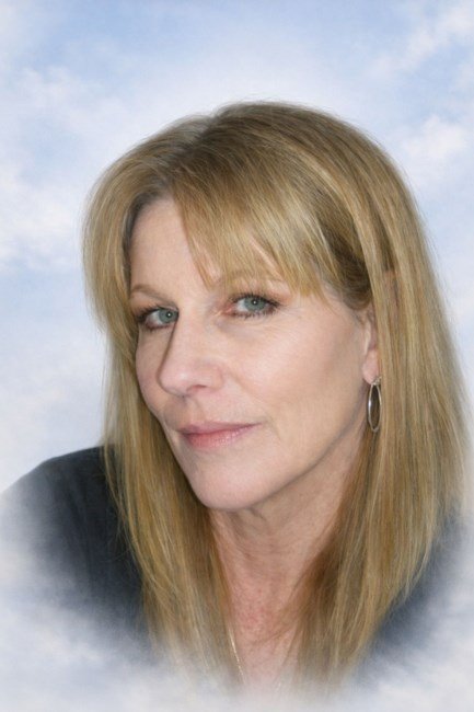 Woman with long hair and hoop earrings.