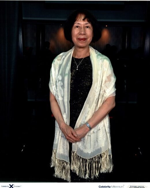 Woman wearing elegant shawl at formal event.