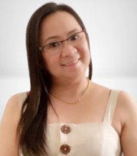 Smiling woman wearing glasses and white top