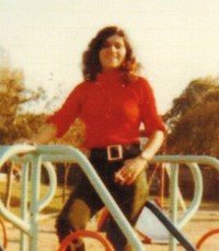 Person standing on playground equipment outdoors