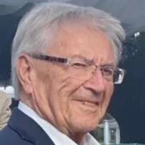 Smiling elderly man in glasses outdoors