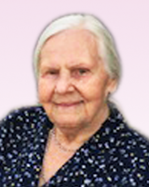 Elderly woman smiling in floral blouse