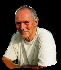 Smiling elderly man in white shirt on black background.