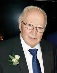 Elderly man in suit with boutonniere