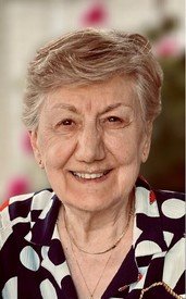 Smiling elderly woman with short hair indoors