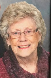 Smiling elderly woman with glasses and short hair