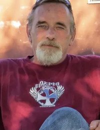Man in a red shirt outdoors