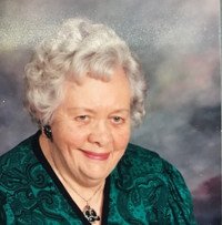 Senior woman smiling in a green dress