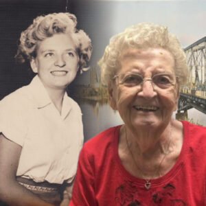 Elderly woman with vintage photo of herself.