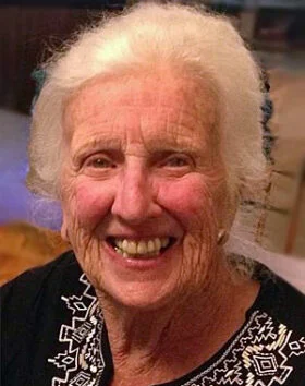 Smiling elderly woman with white hair