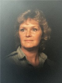Vintage portrait of a woman with curly hair.