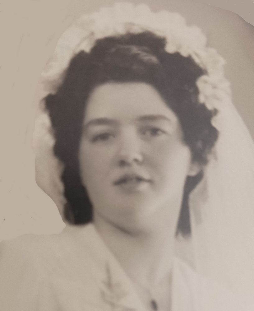 Vintage bride portrait with floral headpiece.