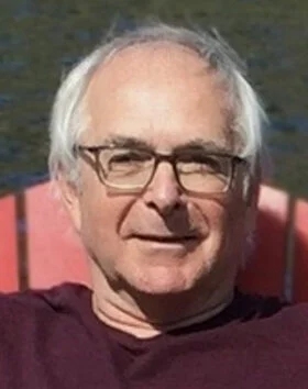 Person sitting outdoors on a sunny day